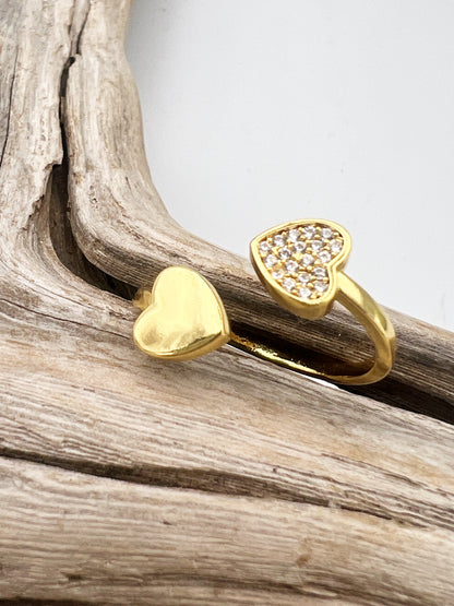 Gold-plated stainless steel ring with CZ-studded heart  and plain heart. Adjustable, waterproof, and hypoallergenic.