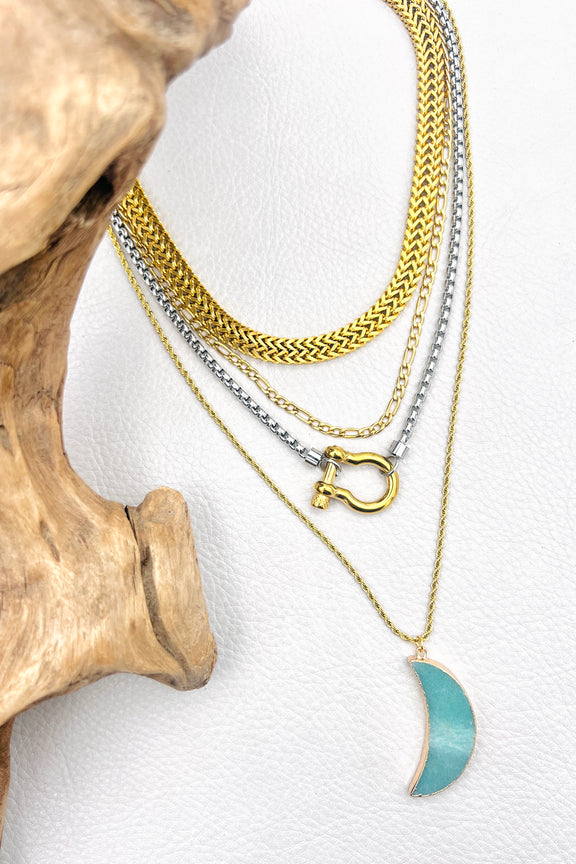 layered gold and silver chunky necklaces with green moon and carabiner 