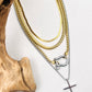 Four layered stainless steel necklaces in gold and silver with carabiner and cross