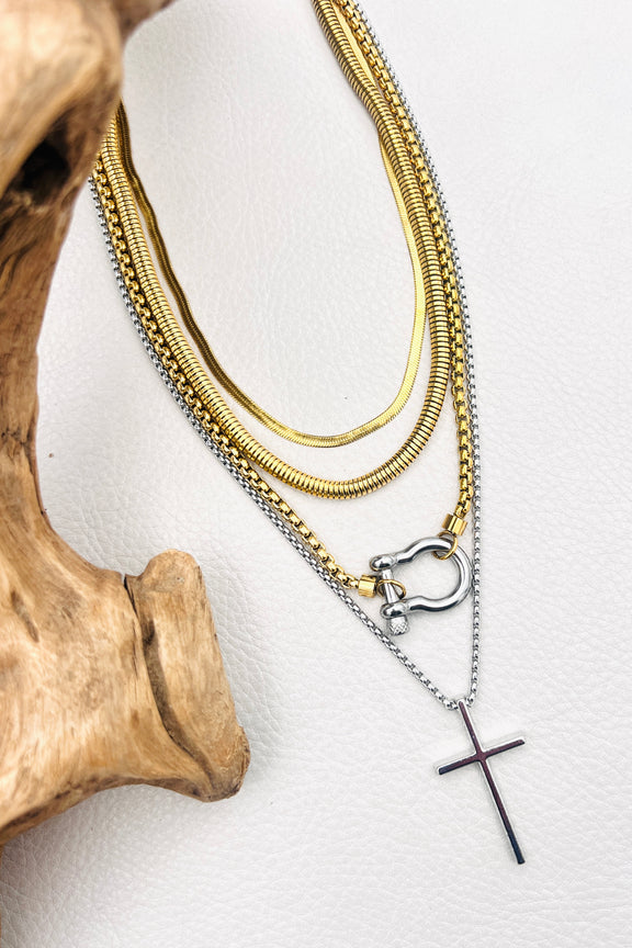 Four layered stainless steel necklaces in gold and silver with carabiner and cross