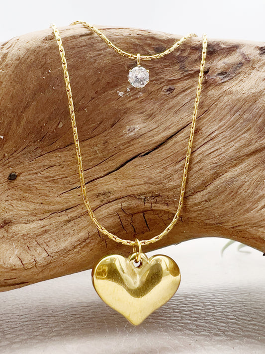 layered gold necklace with cubic zirconia and golden heart