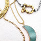 layered gold and silver chunky necklaces with green moon and carabiner 