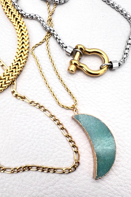 layered gold and silver chunky necklaces with green moon and carabiner 