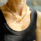 woman wearing a Chunky gold stainless steel necklace with a toggle clasp for a statement look