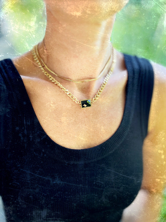 layered gold chain necklace with a facetted black gem by Real to the Roots