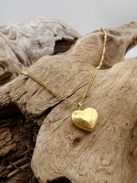  golden heart necklace with the word love on it. perfect for layering