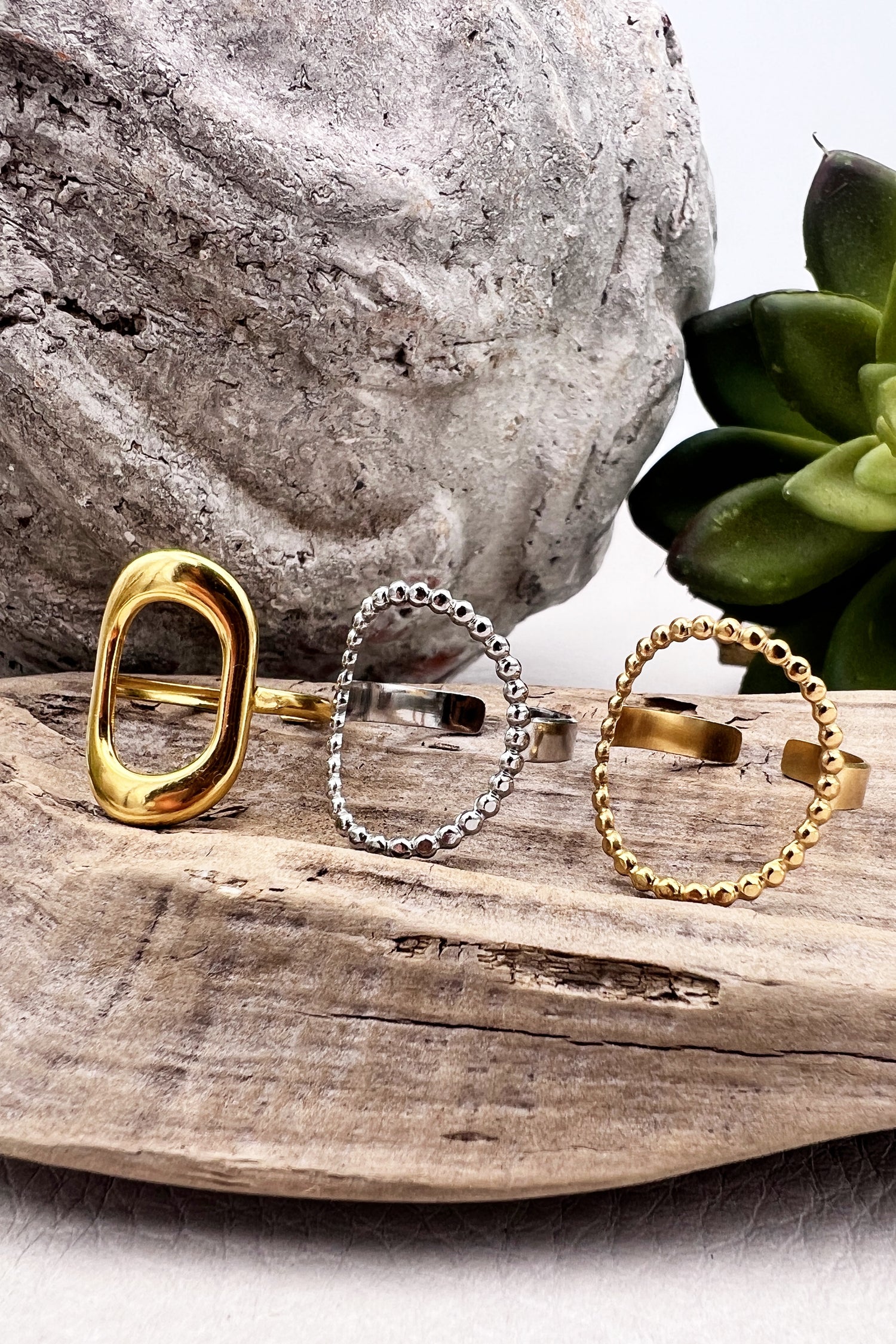 Gold-plated stainless steel rings featuring hollow oval designs. Adjustable, waterproof, and perfect for everyday minimalist style.