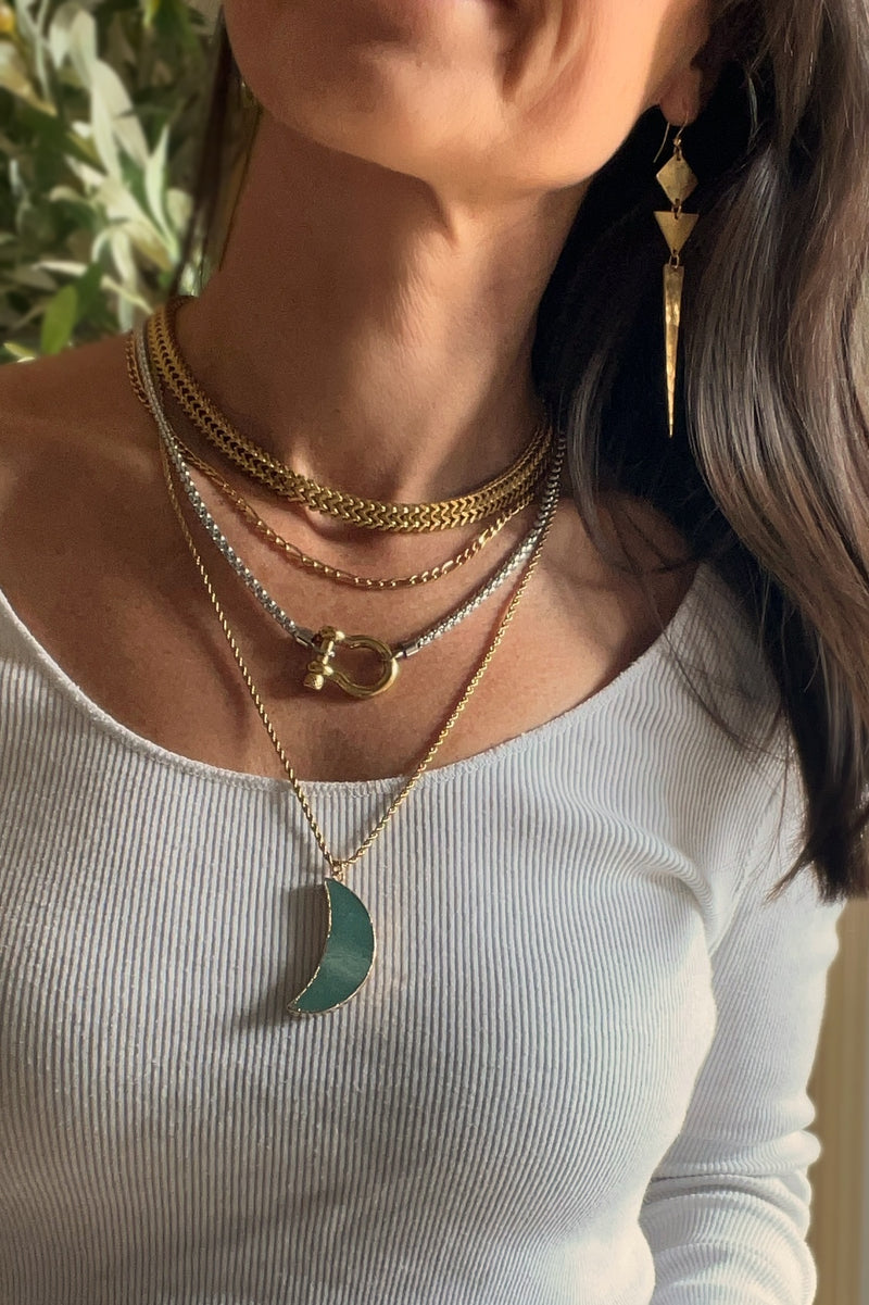 layered gold and silver chunky necklaces with green moon and carabiner 