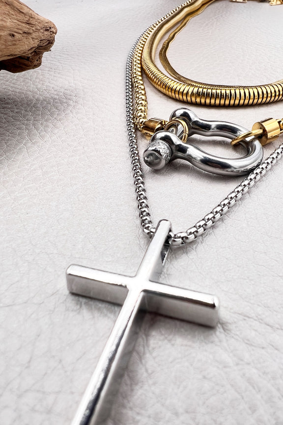 Layered stainless steel, necklaces in gold and silver with cross and carabiner