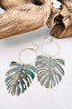 Vivacious modern boho statement jewelry – handcrafted blue patina monstera leaf earrings, a bold and artistic design from Real to the Roots Jewelry. 